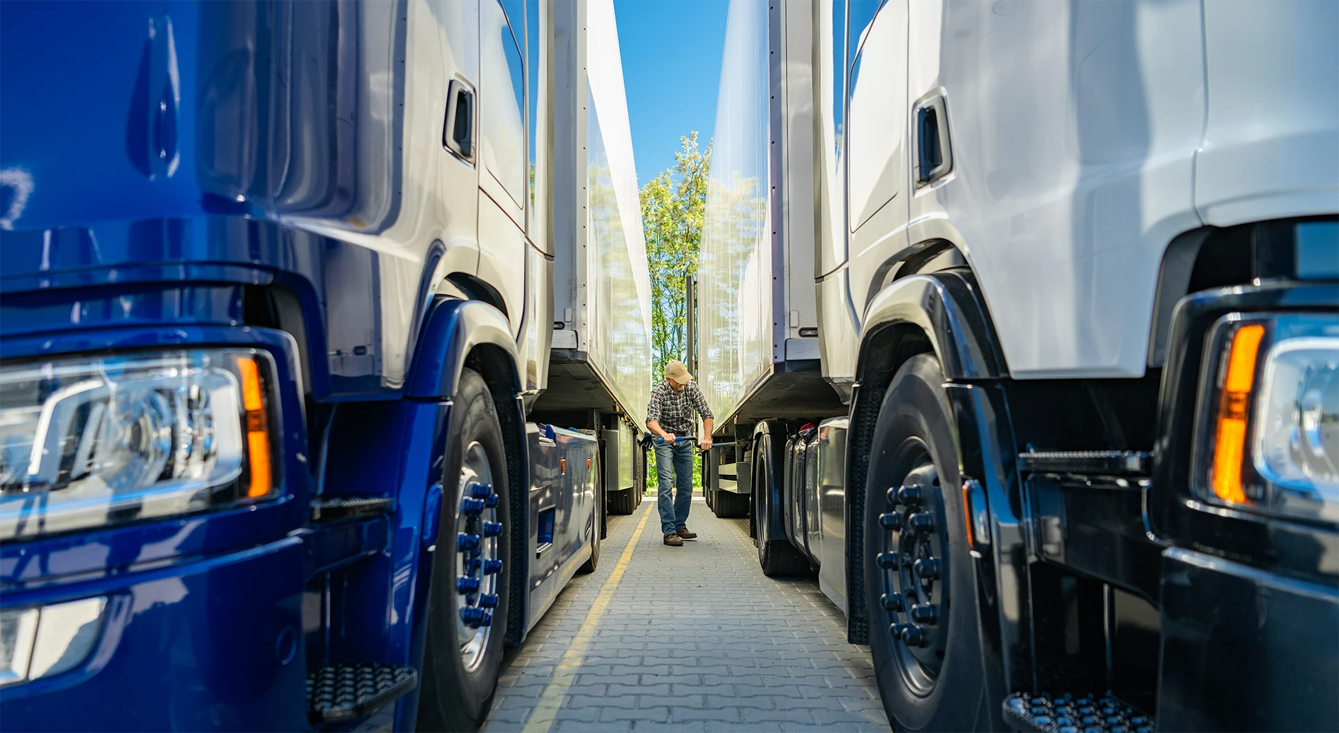 two-large-semi-trucks-parked-closely-together